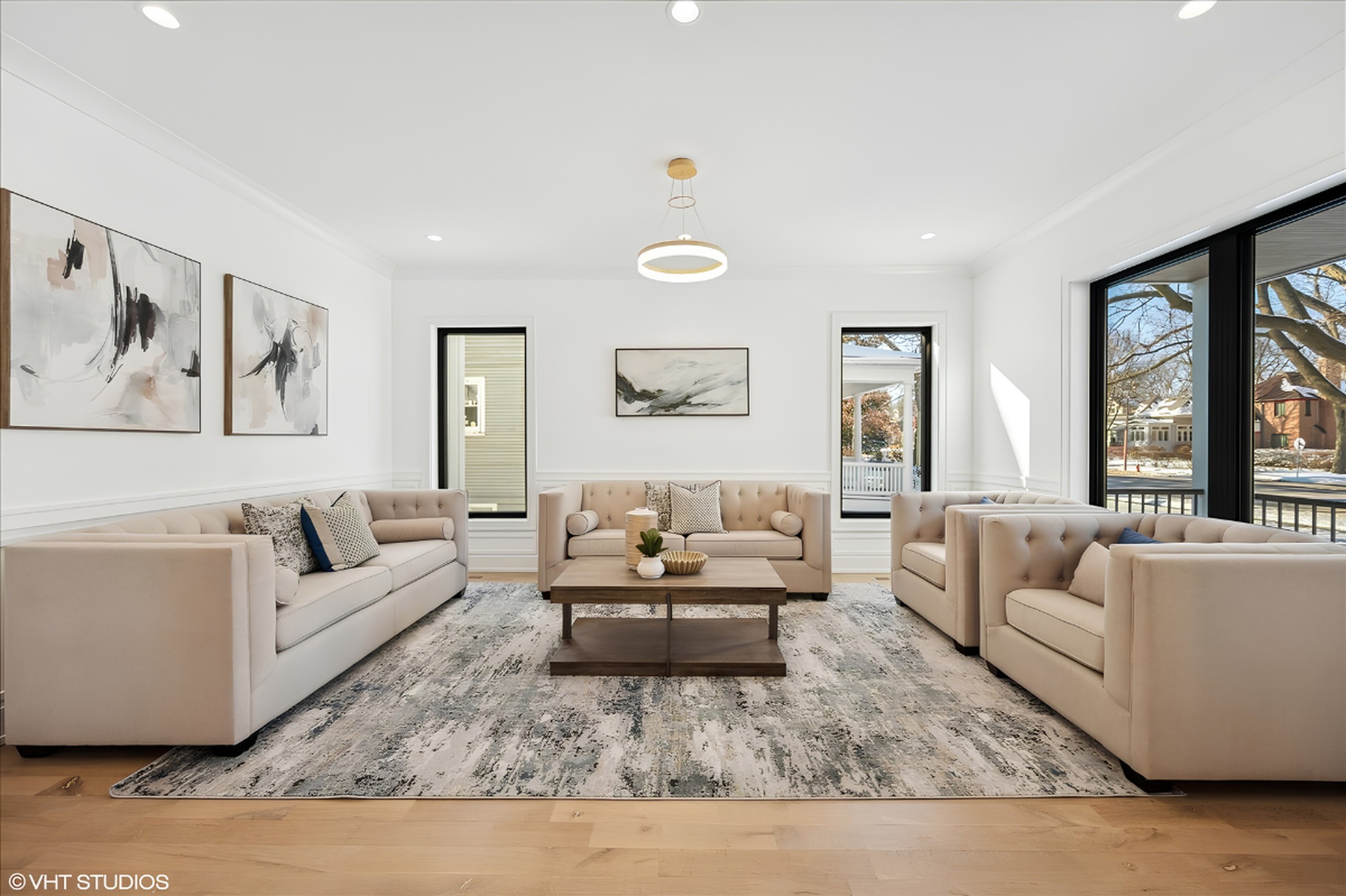 Staged living room with oak floors in a Gimbel Group listing